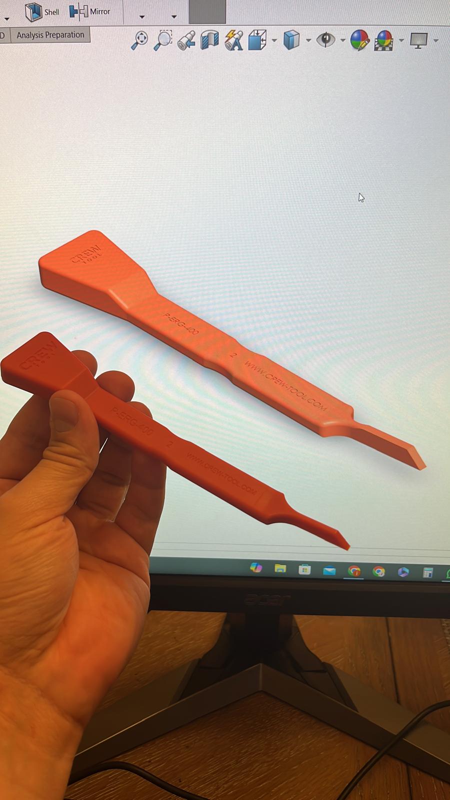 Finished scraper held